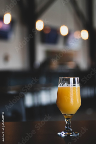 glass of beer on wooden table