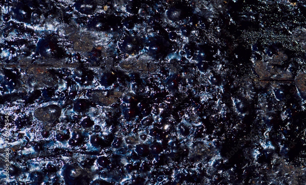 Close up of dried black tar on a wooden power pole with glossy rough textures. - obrazy, fototapety, plakaty 