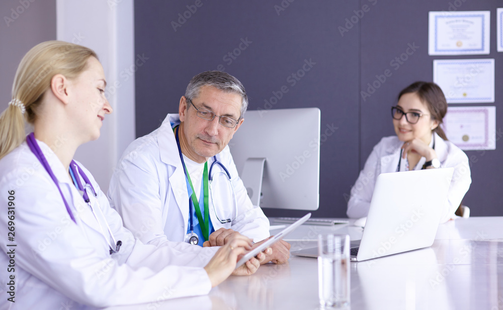 Doctors having a medical discussion in a meeting room Doctors having a medical discussion in a meeting room