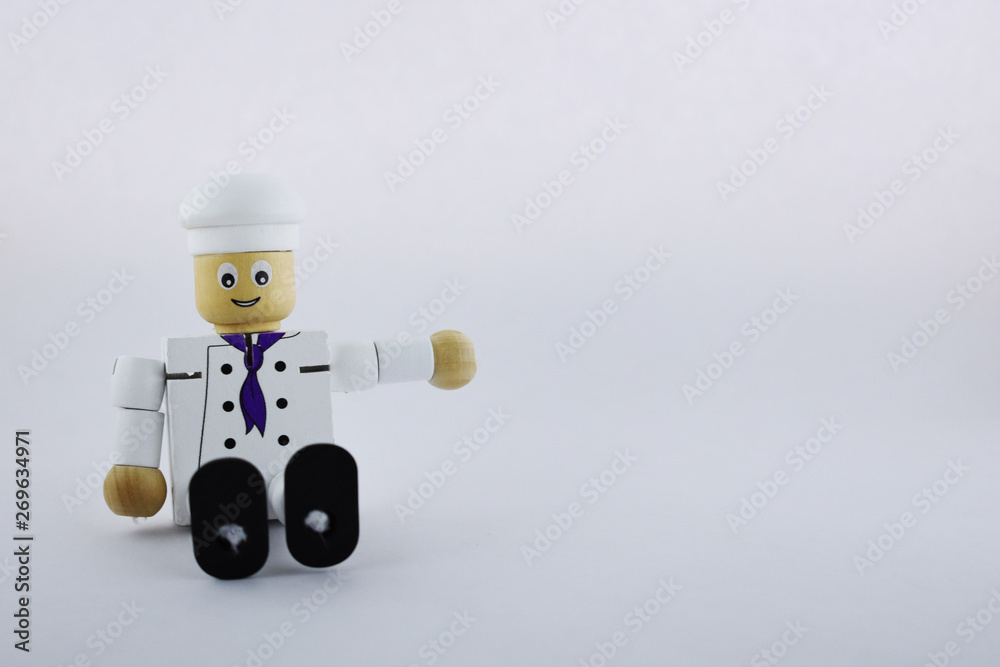 Naklejka premium cook chef. wooden toy cook chef