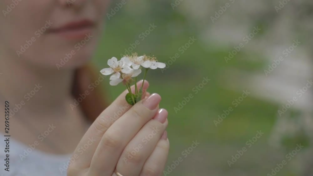 portrait of a woman in a beautiful blooming garden portrait of a woman in a beautiful blooming garden