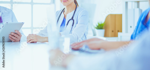 Doctors consulting with each other in a hospital conference room