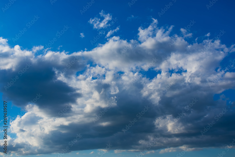 Fototapeta premium Blue sky with clouds. Blue sky with nimbostratus clouds. Blue sky with clouds background.