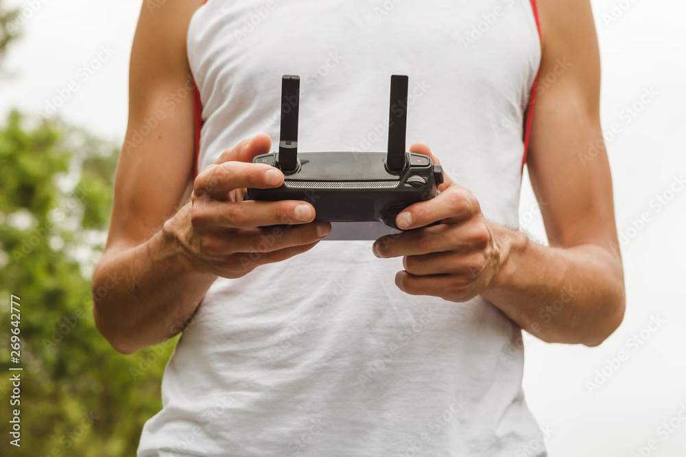 Hands holding a remote control drone camera Hands holding a remote control drone camera