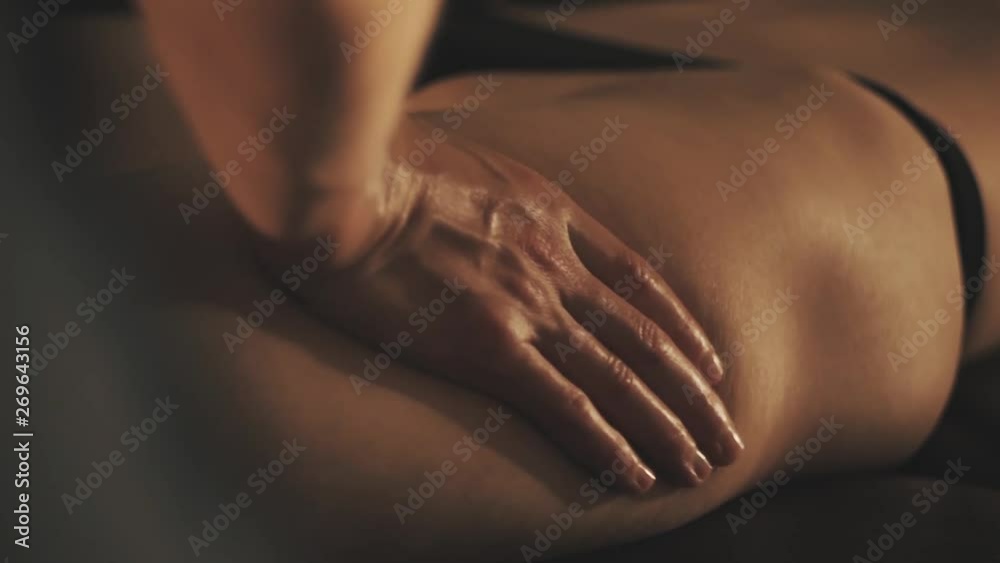 Beautiful young woman gets a relaxing massage Beautiful young woman gets a relaxing massage