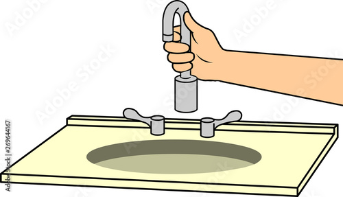 hand installing a faucet in the sink