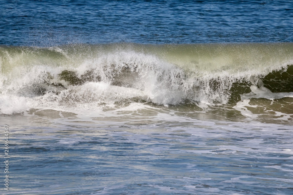 empty wave crashing in the ocean 