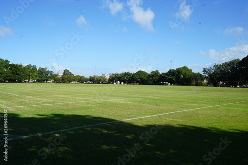 an empty park with a soccer field