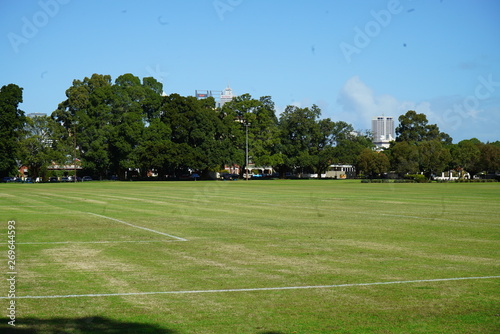 an empty park with a soccer field