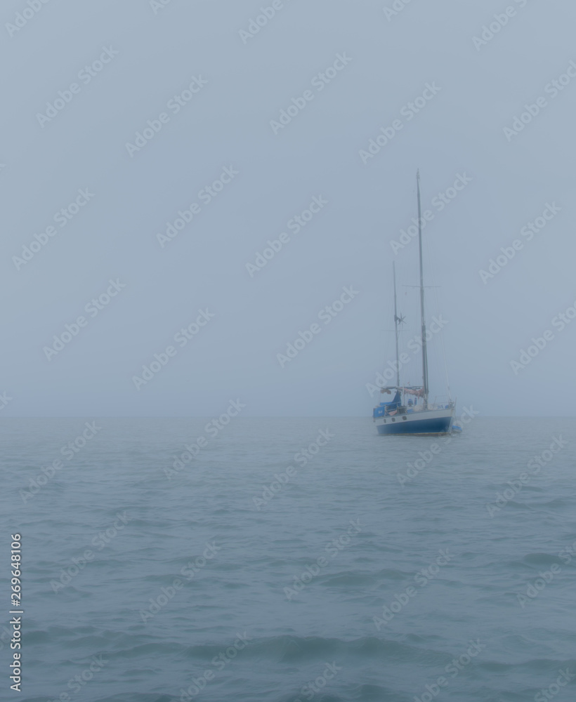 Misty Boat Anchored
