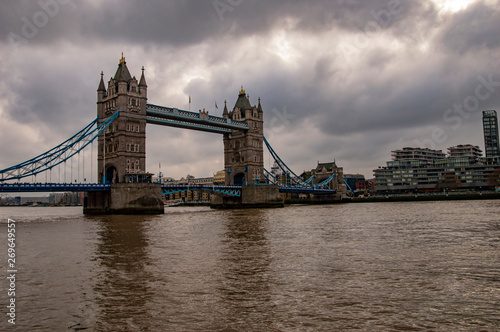 London skyline on the river thames with dark clouds