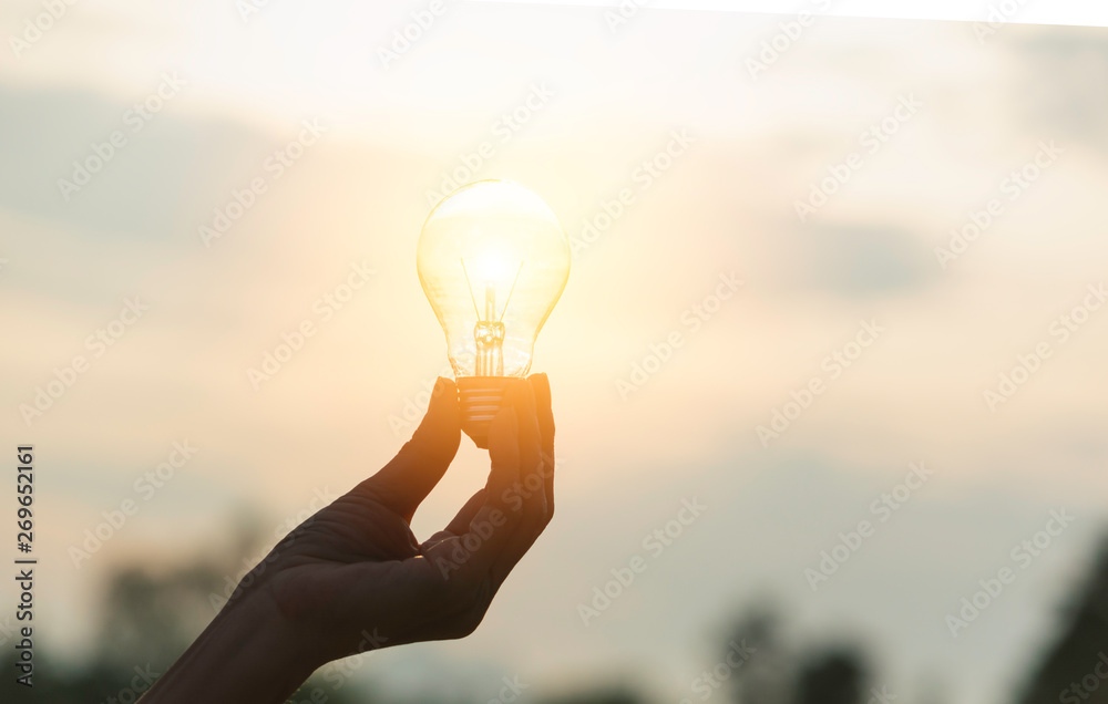 Innovation or creative concept of hand hold a light bulb and copy space for insert text. - obrazy, fototapety, plakaty 