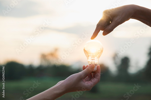 Innovation or creative concept of hand hold a light bulb and copy space for insert text.