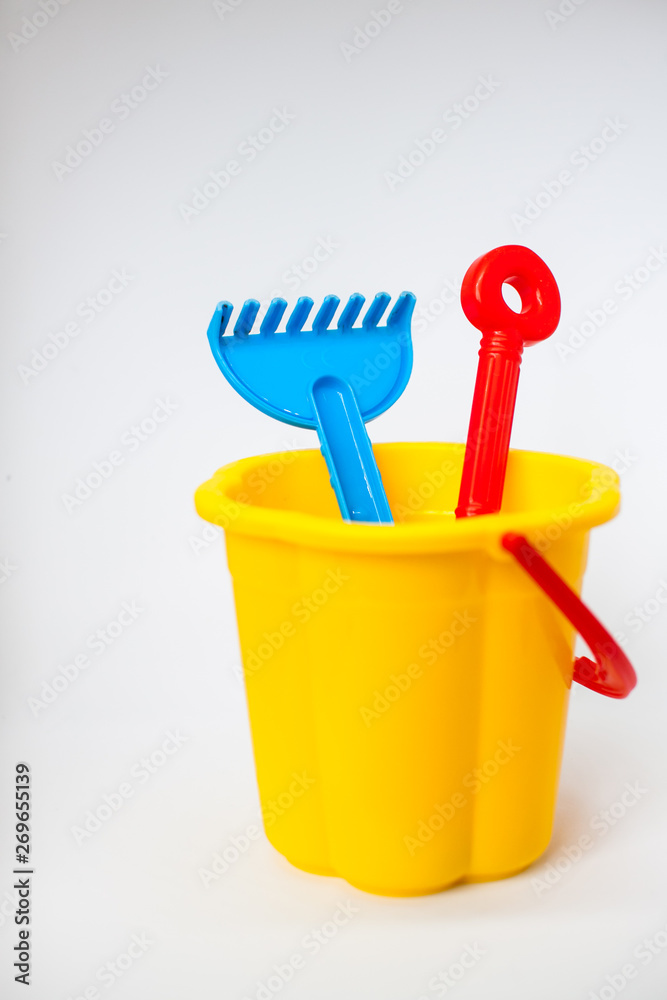 Bright children toys for playing in the sandbox on a white background Bright children toys for playing in the sandbox on a white background