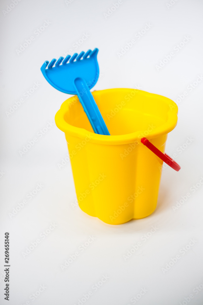 Bright children toys for playing in the sandbox on a white background Bright children toys for playing in the sandbox on a white background