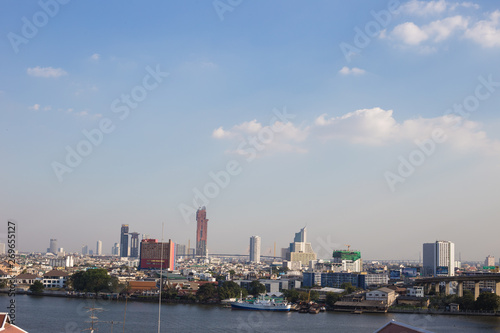 Modern city downtown building of Bangkok skyling with river
