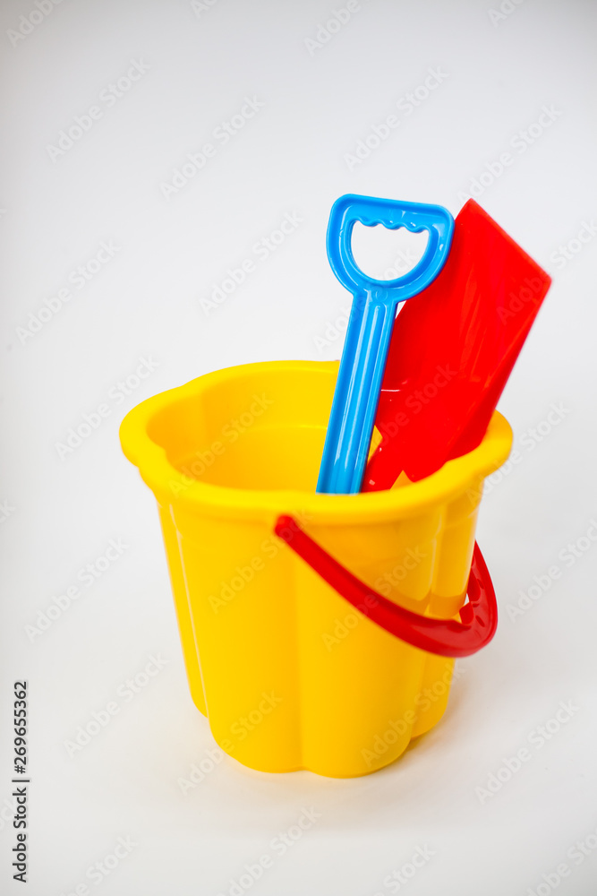 Bright children toys for playing in the sandbox on a white background Bright children toys for playing in the sandbox on a white background