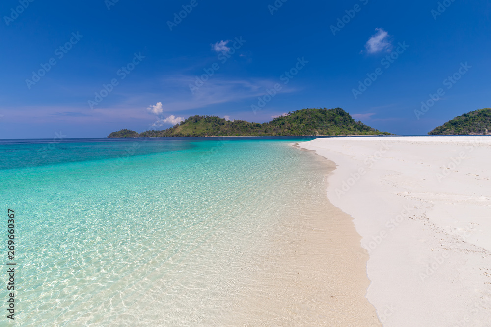 Tropical beach paradise and the blue sky at Khai Island in Satun Province , Thailand Tropical beach paradise and the blue sky at Khai Island in Satun Province , Thailand