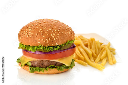 Big fresh tasty burger on wooden board isolated on white background