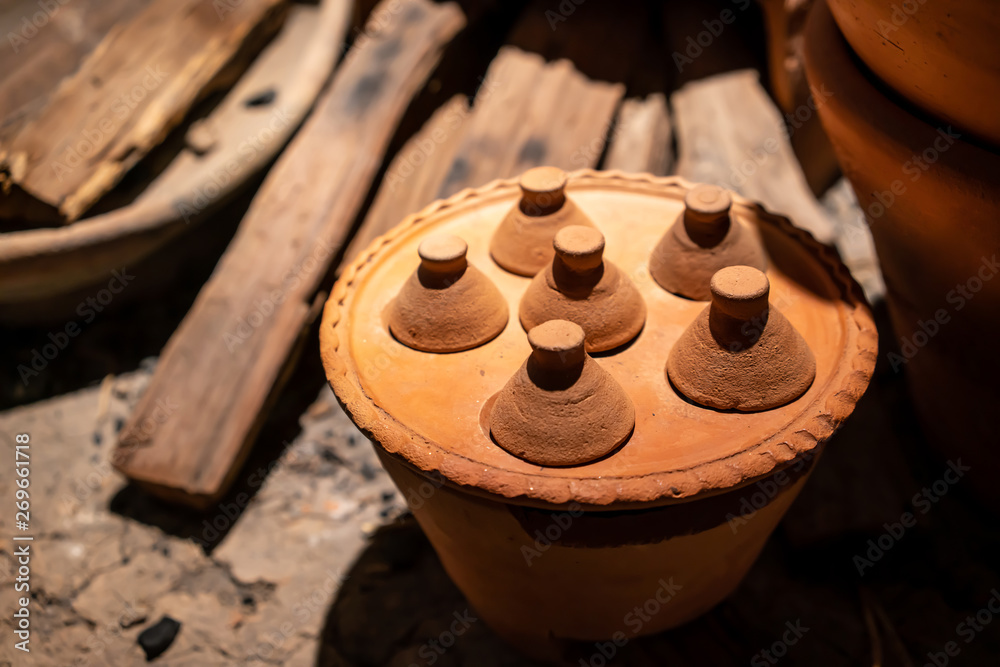 Traditional asian clay pots and stoves. selective focus.