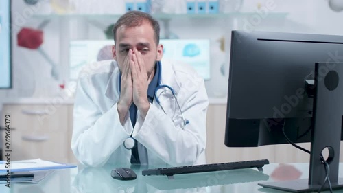 Wallpaper Mural Tired doctor in his office is working. 3D brain scans in the background Torontodigital.ca