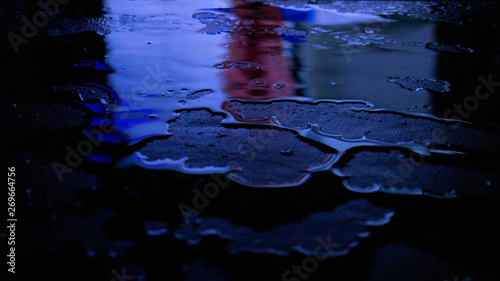 Wet asphalt, night scene of...