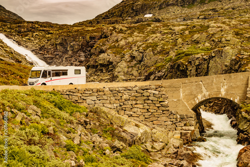 Camper car drive in mountains, Norway photo