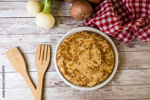 Traditional spanish omelette on wooden table