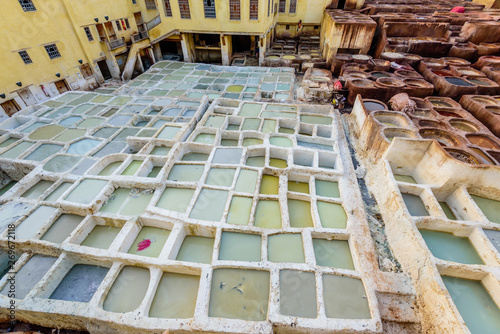 Sightseeing of Morocco. Tanneries of Fez. Dye reservoirs and vats in traditional tannery of city of Fez, Morocco photo