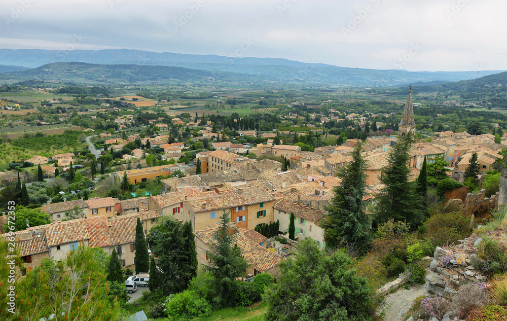 View of church houses and surrounding fields in St Saturnin les Apt, France