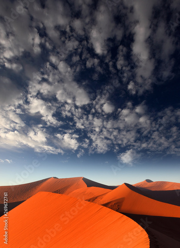 Red sand dune with dramatic sky, Sossusvlei, Namibia