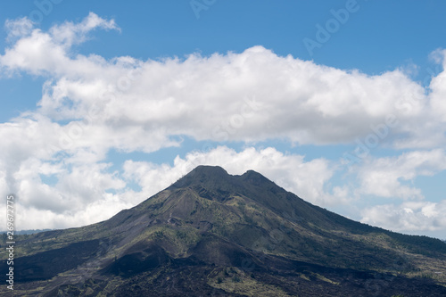 Mount Agung volcano against a blue sky