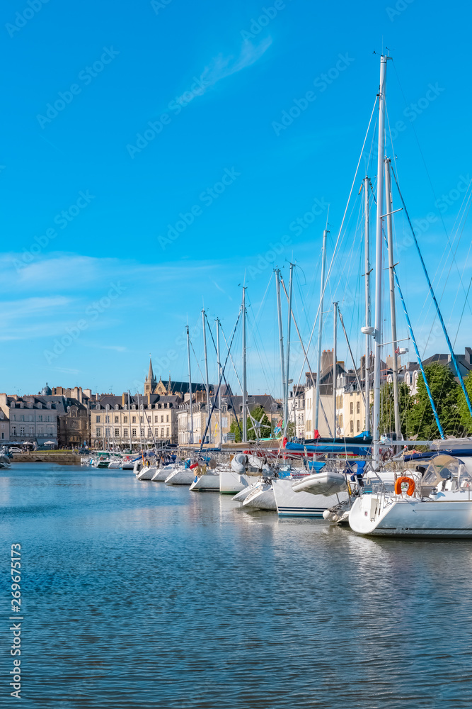      Vannes harbor, in the Morbihan, Brittany, boats in the marina, with typical houses and the cathedral in background 