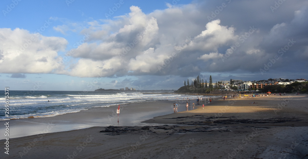 People relaxing at the beach in Autumn time afternoon.  Alex is a coastal town situated on Queensland's Sunshine Coast.