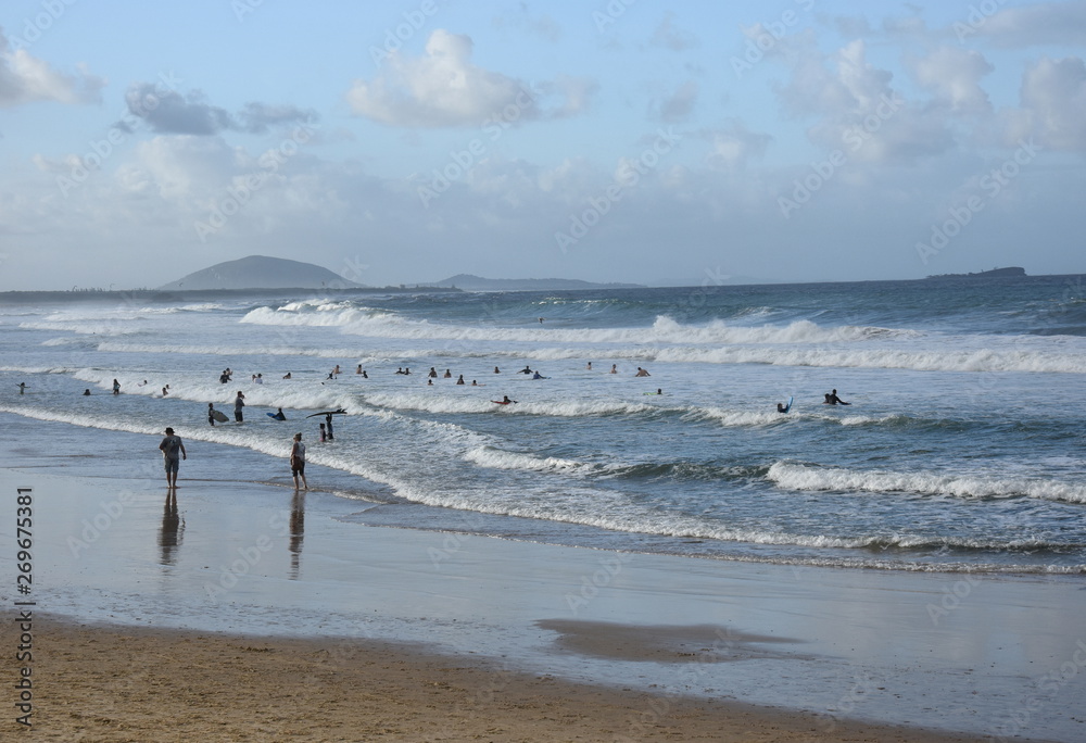 People relaxing at the beach in Autumn time afternoon.  Alex is a coastal town situated on Queensland's Sunshine Coast.