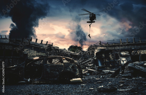 Military helicopter and forces in destroyed city to find leader of enemy.