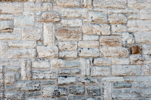 Stone wall. Horizontally-vertical laying of a stone.