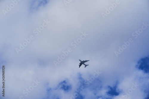 Plane flying to the clouds after take off
