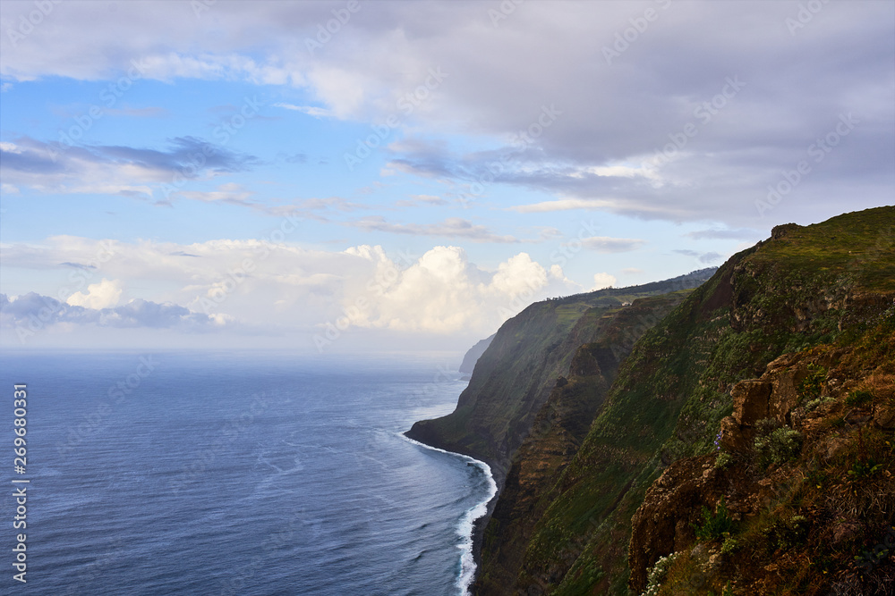 Cliff and blue ocean view in Madeira island, near Ponta do Pargo, Portugal