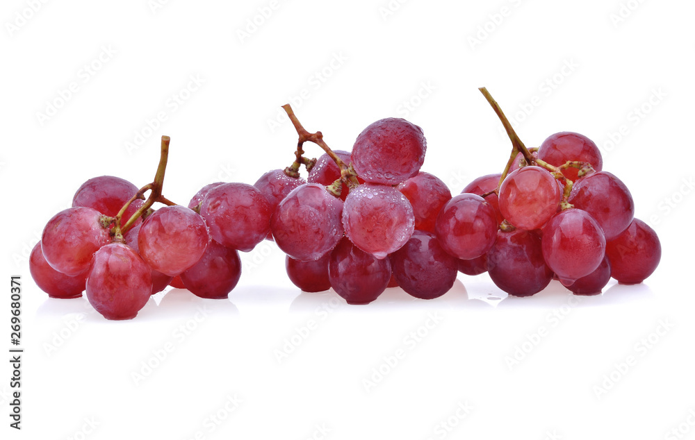 Ripe red grape with drops isolated on white.
