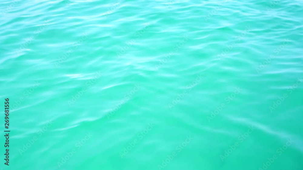 Blue sea wave water ocean surface texture for natural background. Summer sky clear view holiday relax background. Reflection of sunlight or sun shine water natural. Blue sea wave water ocean surface texture for natural background. Summer sky clear view holiday relax background. Reflection of sunlight or sun shine water natural.