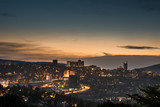 Kigali city centre skyline and surrounding areas lit up at dusk. Rwanda