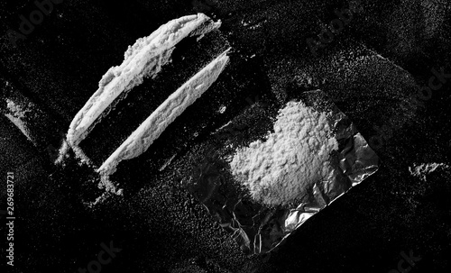 Cocaine lines isolated on black background, clipping path 