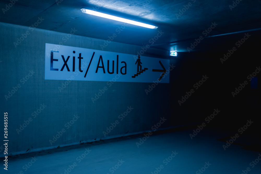 Exit sign in underground parking lot