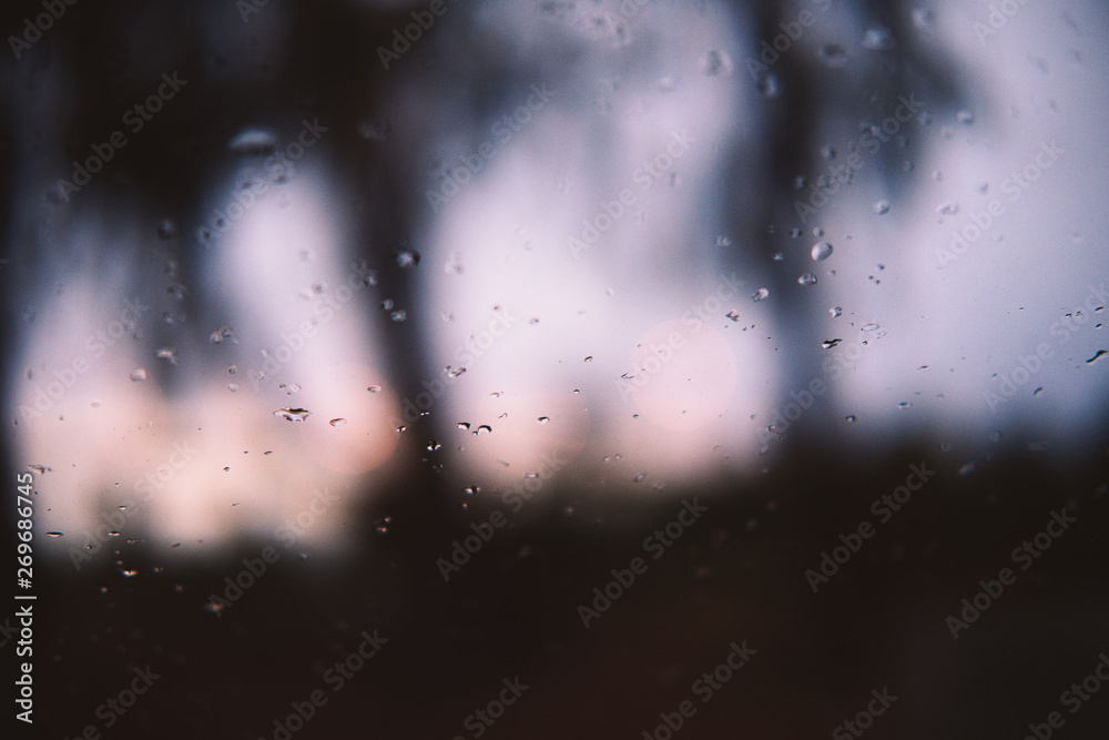 rain drops on window at dusk rain drops on window at dusk