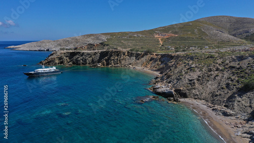Aerial drone photo of deep turquoise crystal clear sea and rocky sea shore, Folegandros island, Cyclades, Greece