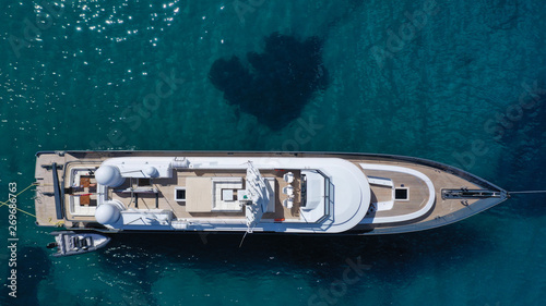 Aerial drone top view photo of luxury yacht docked in Mediterranean destination port