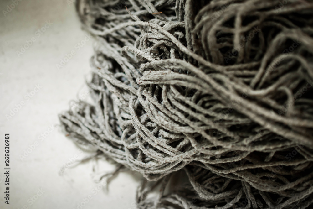 Closeup of Dirty Mop After Cleaning House. Housework Equipment Closeup of Dirty Mop After Cleaning House. Housework Equipment