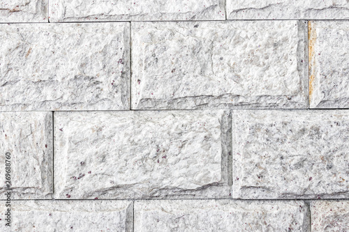 close up on wall of white stones with details, stone texture