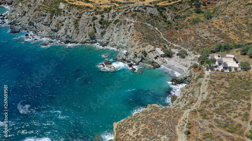 Aerial drone photo of secluded deep turquoise beach of Agios Nikolaos with crystal clear sea and sandy sea shore, Folegandros island, Cyclades, Greece © aerial-drone